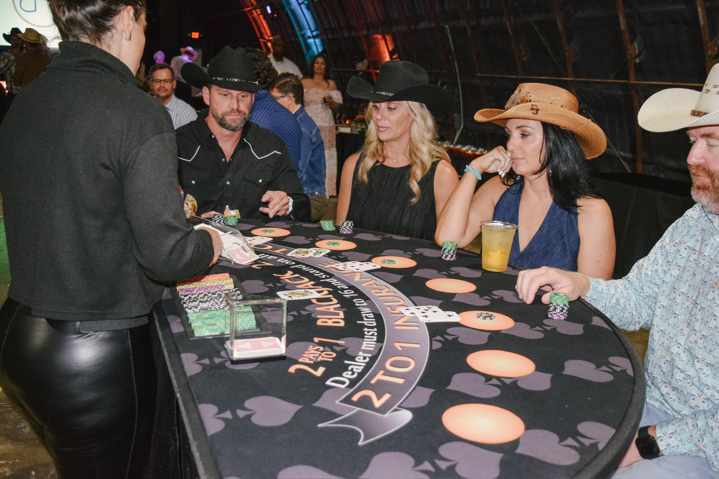 Guests enjoying casino games at a Blue Haven Ranch event